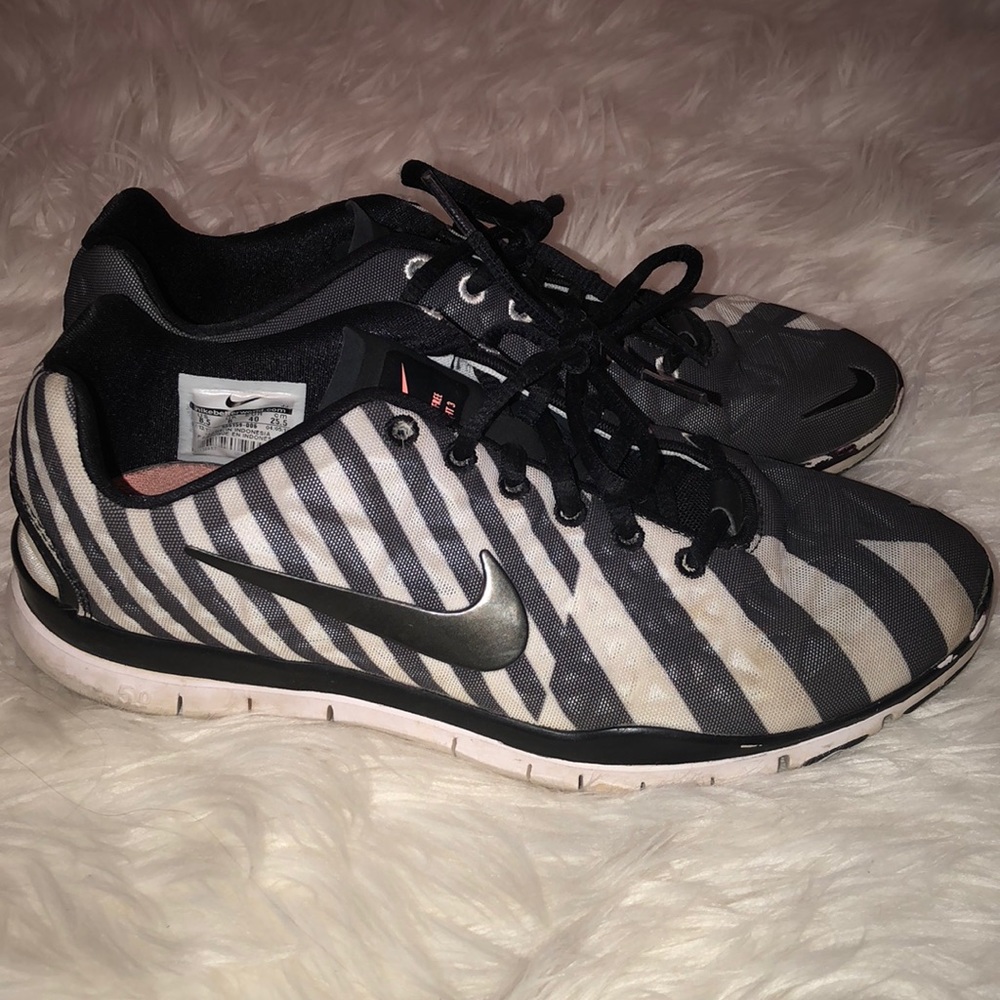 Black and white striped Nike free runs